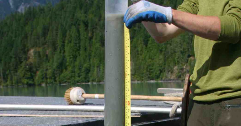 paleolimnology workshop photo of someone measuring a core.