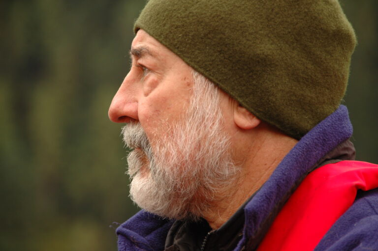 Dr. Paul Paquet looks out into the forest.