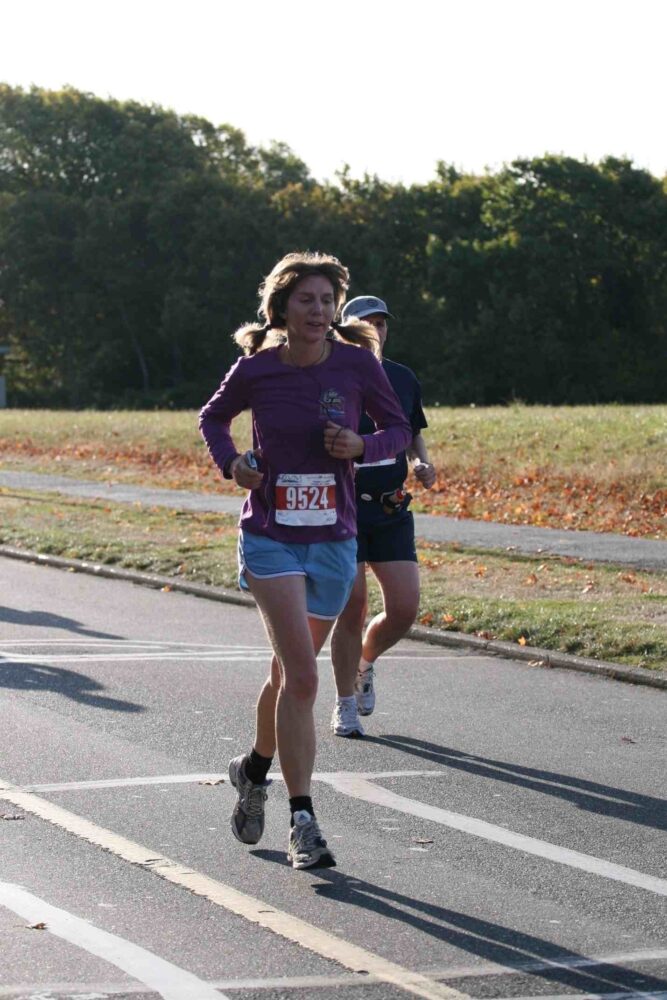 A woman running in a race.