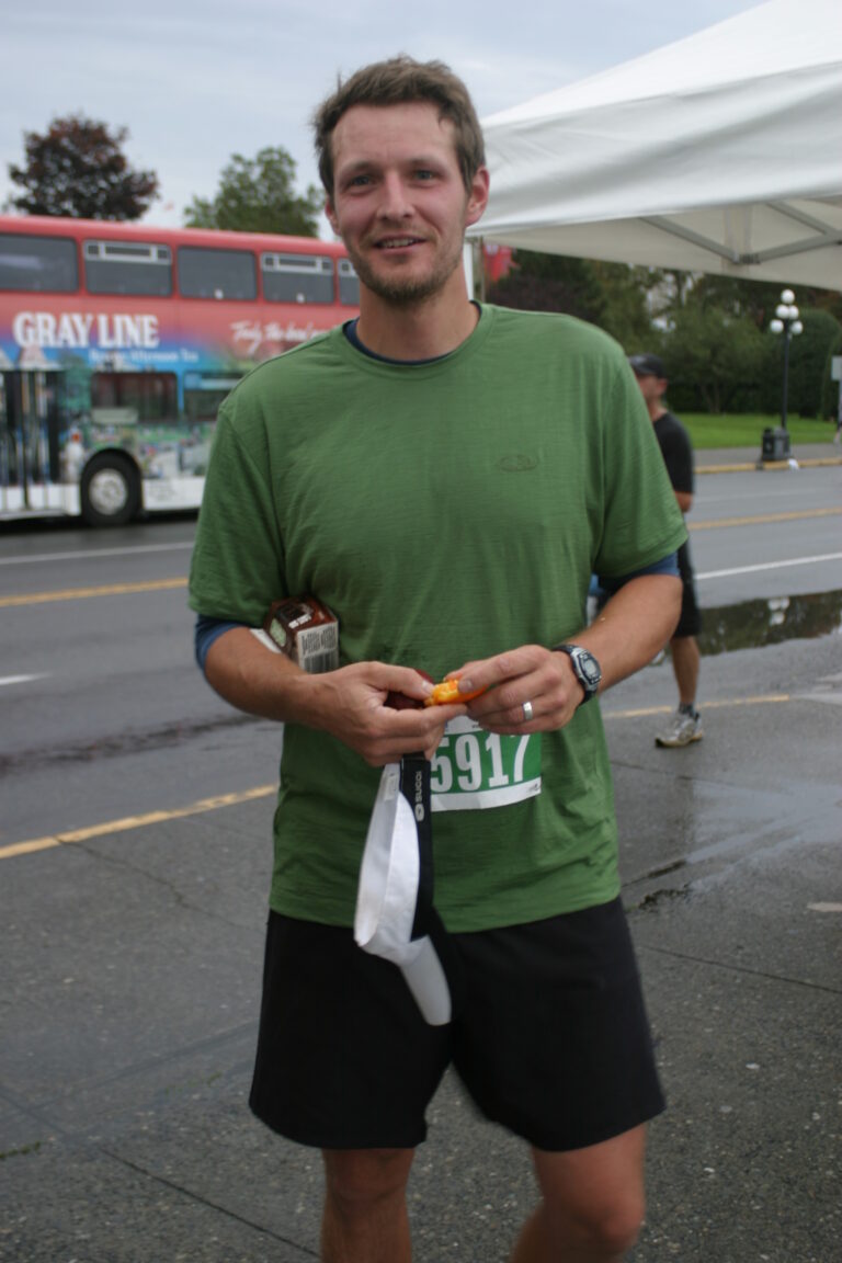 A man wearing a green t-shirt.