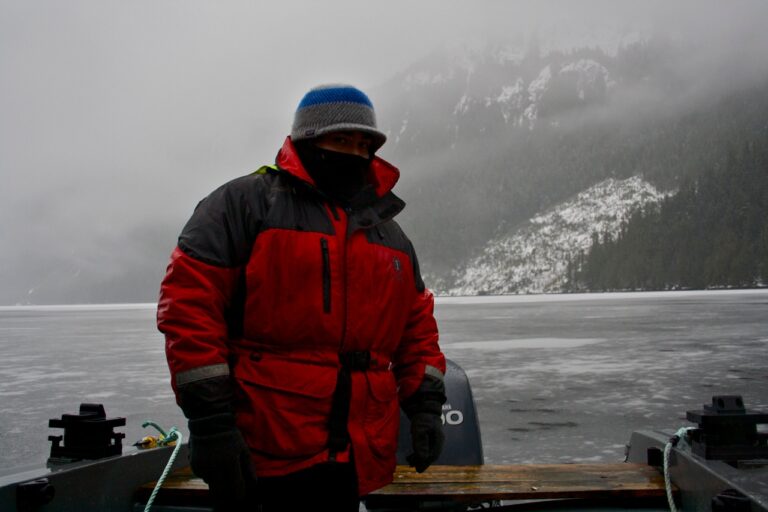 A man standing on a boat.
