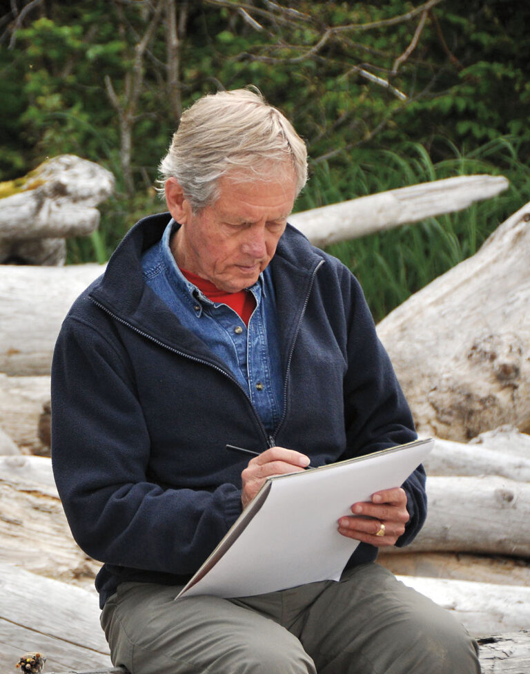 A man writing on a piece of paper.