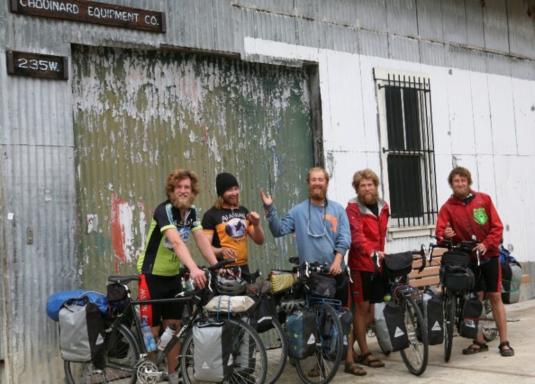 A group of people standing in front of a building.