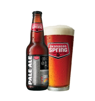 A bottle of pale ale next to a glass.