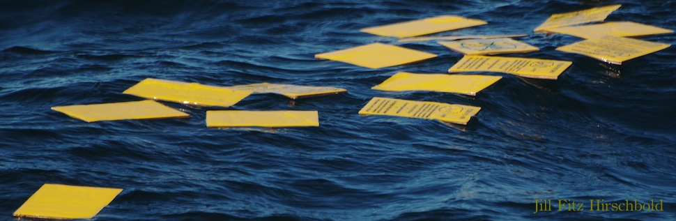 Yellow paper floating in the ocean.