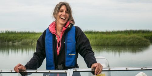 MacDuffee laughs aboard a small boat on the Fraser River.