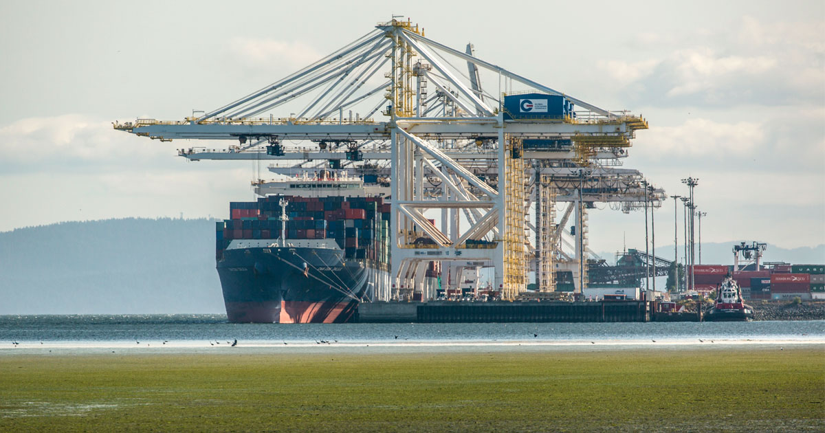 A container ship get loaded at a terminal near Vancouver.