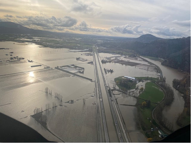 Flood of the Fraser River Valley with a highway running through. 