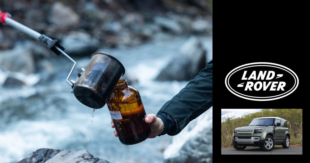 Some Healthy Waters team members do water sampling over a river and rocks on the lower mainland.
