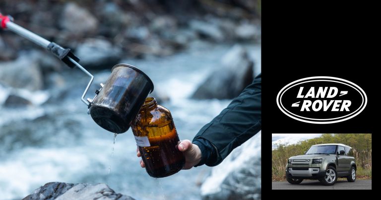 Some Healthy Waters team members do water sampling over a river and rocks on the lower mainland.