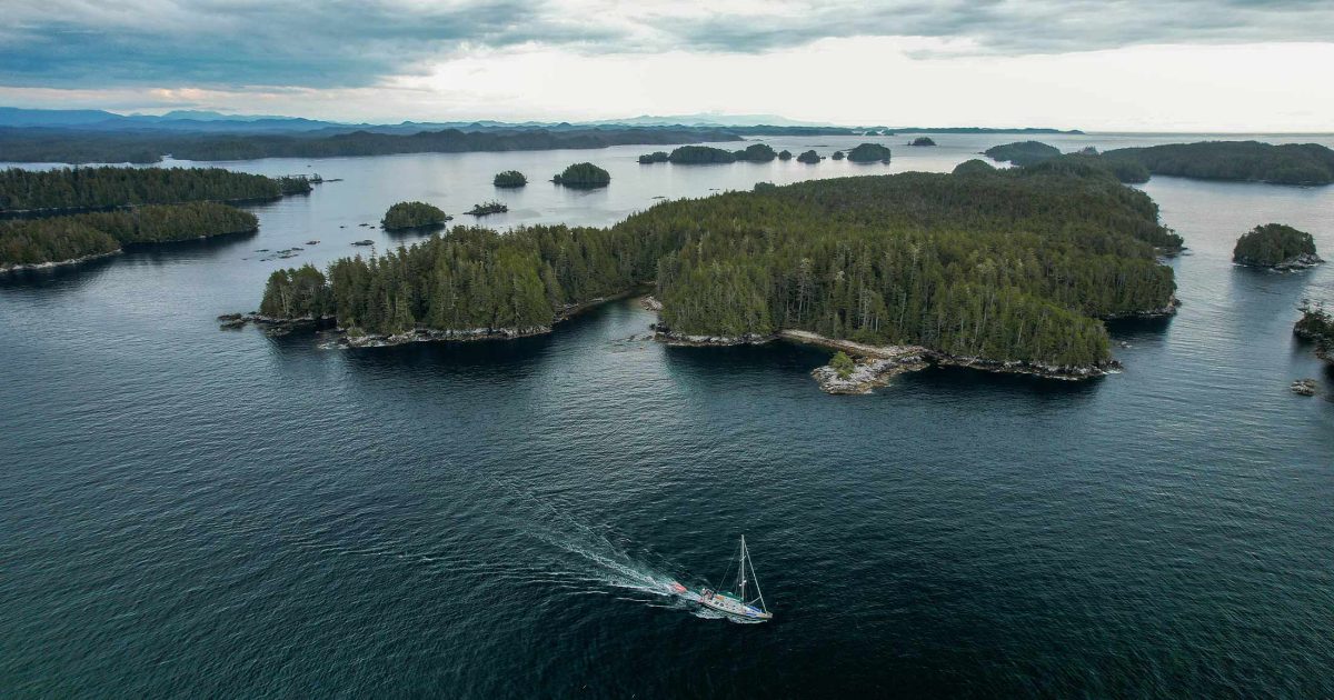 Drone photo of Achiever going through an archipelago of islands.