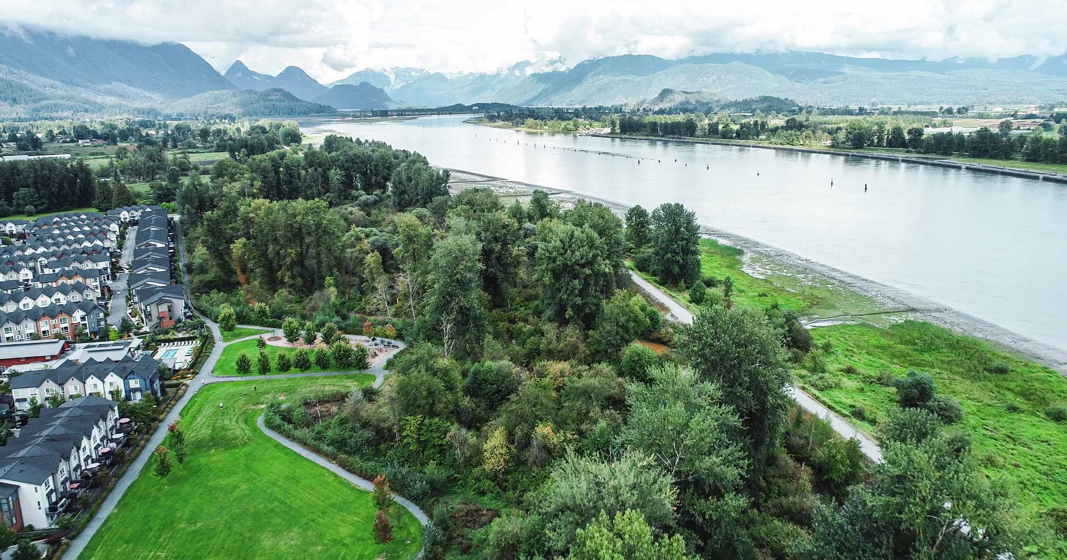 Stunning landscape on the shores of the Fraser River with the coastal mountains looming in the background.
