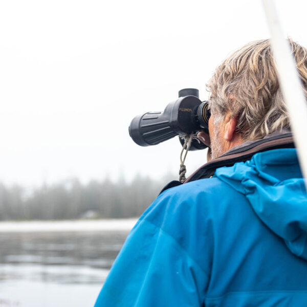 Brian looking through binoculars.