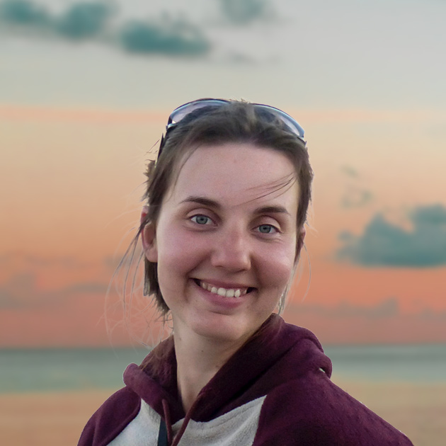 Marie-Ana Mikus smiles happily as the sun sets on the Salish Sea.