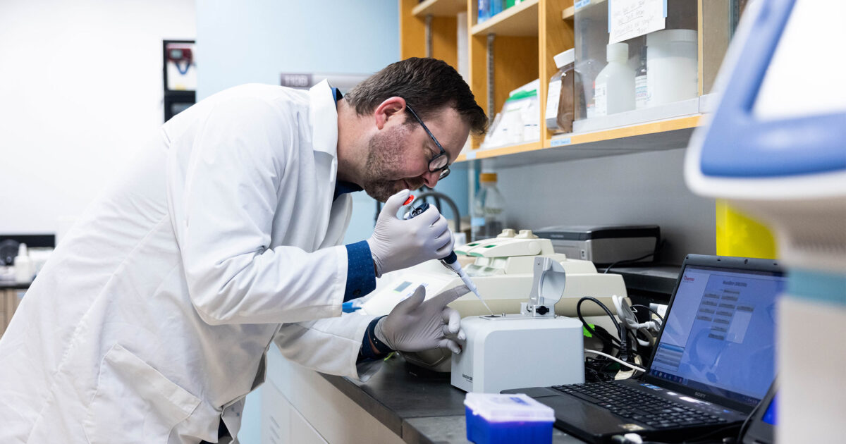 Research scientist, Adam Warner conducting genetics research in our genetics lab.