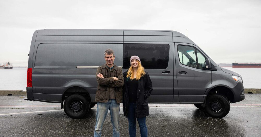 Sam Scott and Peter Ross standing in front of the future mobile lab, which is a grey sprinter van.