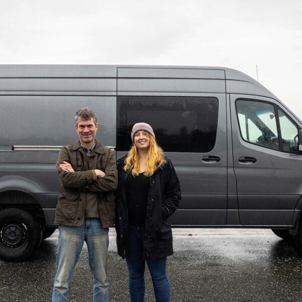 Sam Scott and Peter Ross standing in front of the future mobile lab, which is a grey sprinter van.