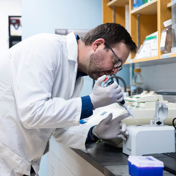 Research scientist, Adam Warner conducting genetics research in our genetics lab.