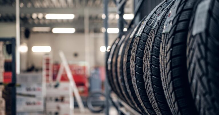 Variety of tires at a busy warehouse.