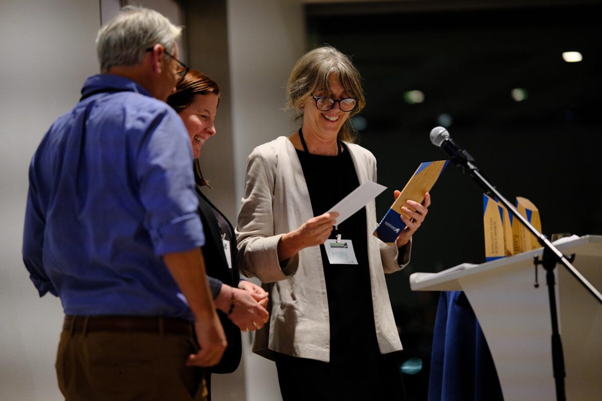 Misty MacDuffee, Raincoast’s Wild Salmon Program Director, awarding the Newman Award for Excellence in Conservation and Research to Rob Williams and Erin Ashe, of Oceans Initiative.