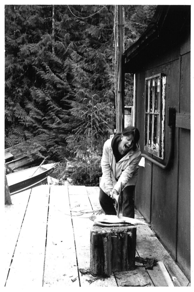 When given a whole frozen salmon that was too large for one meal, Gudrun had a creative solution for thawing only half at a time, May 2002.