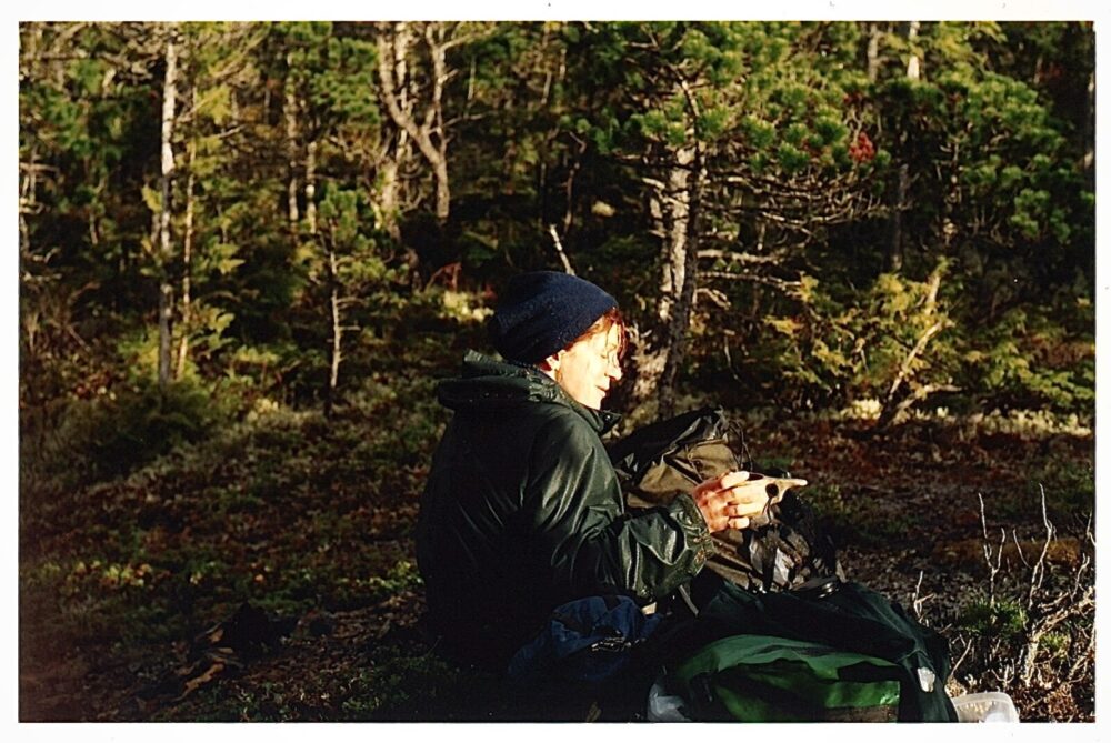 Gudrun enjoying a cup of tea and snack break on a transect survey in Heiltsuk territory, May 2002.
