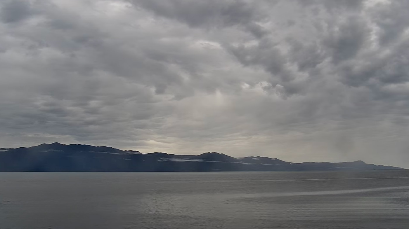 The panoramic view on the Sunshine Coast Livestream with a hundred shades of grey in the clouds and water and horizon.
