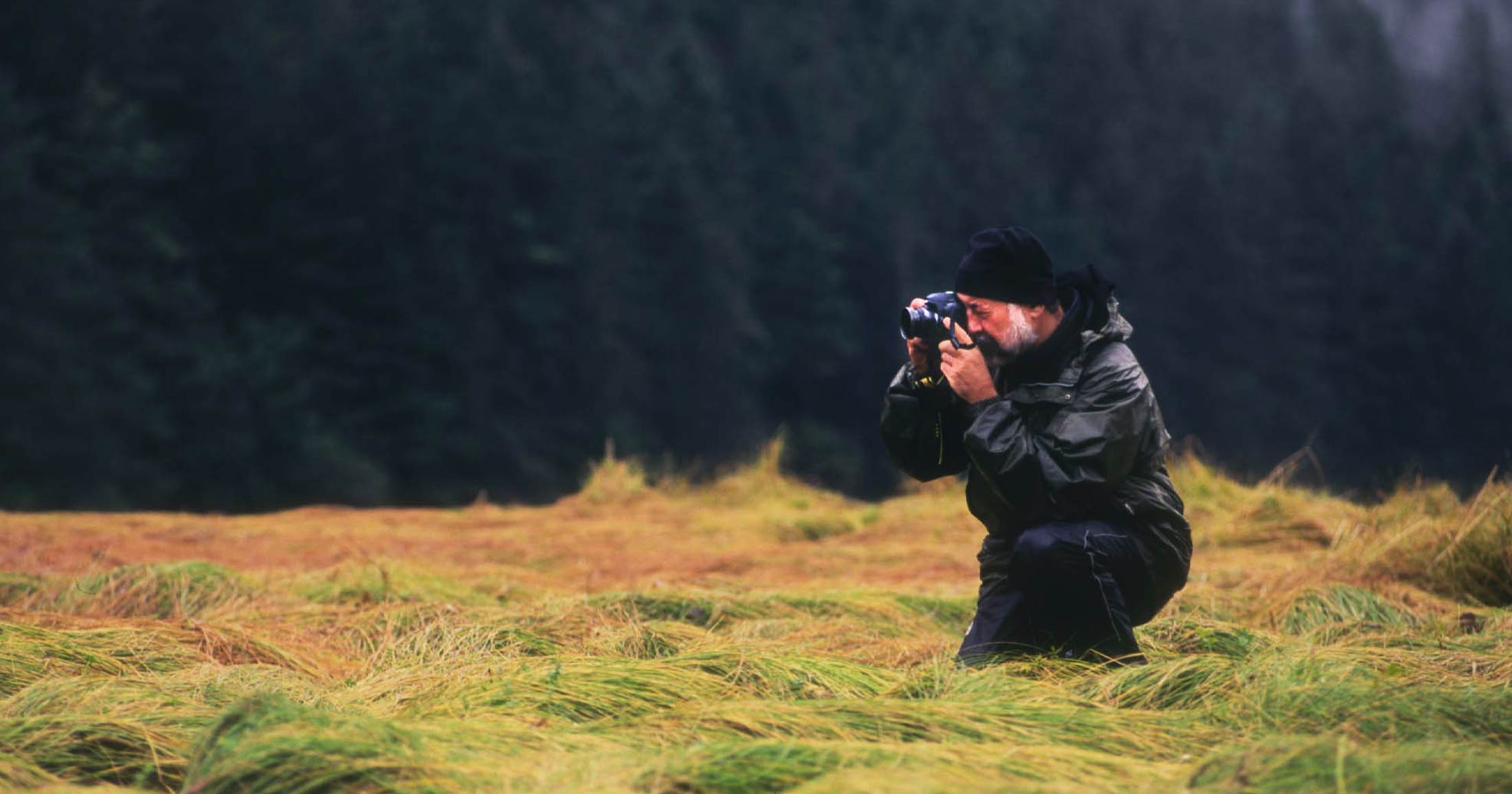 Paul Paquet kneels for the perfect photo.