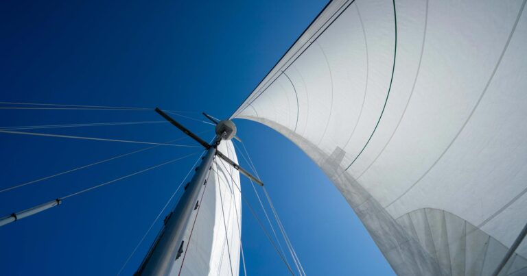 Achiever sales billow in the wind on a stunning bluesky day.