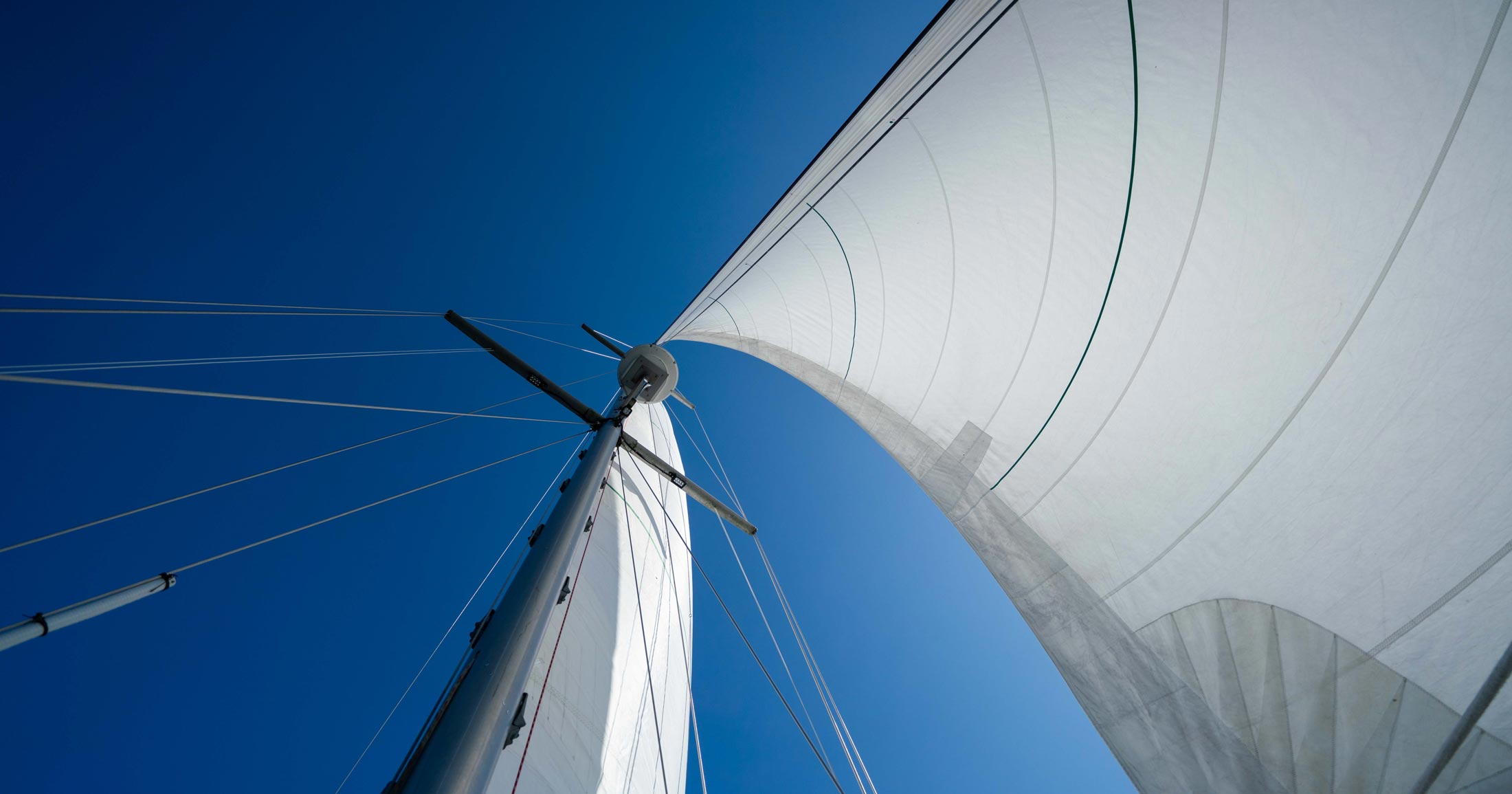 Achiever sales billow in the wind on a stunning bluesky day.