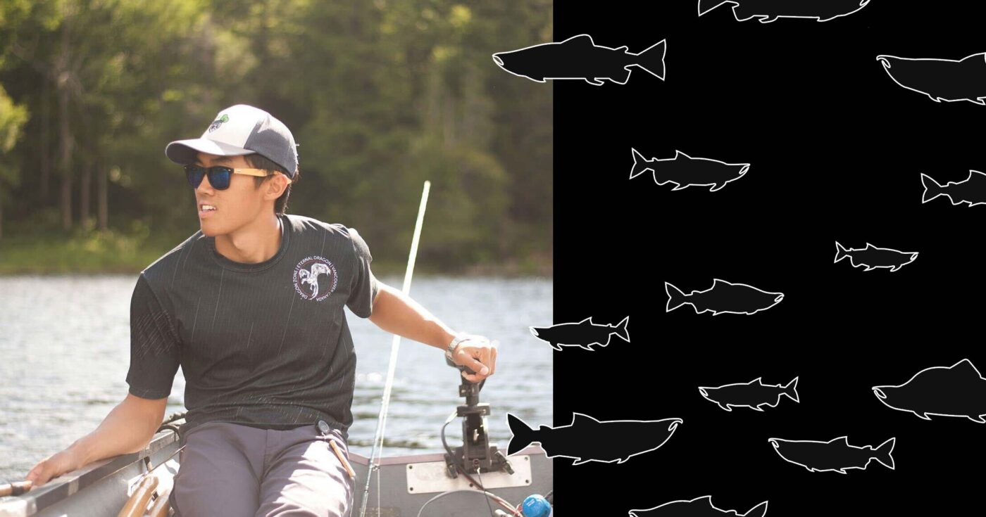 Auston Chhor looking very happy driving a small boat with an outboard engine; Auston is the host of season two of Raincoast Radio.