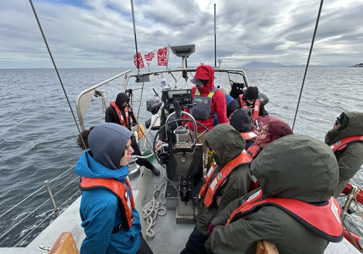 A group of youth participants sailling