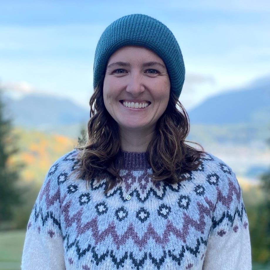Janine McNeilly is a biologist with Raincoast’s Cetacean Research Program, and she's wearing a toque and a very cool knit sweater, smiling!