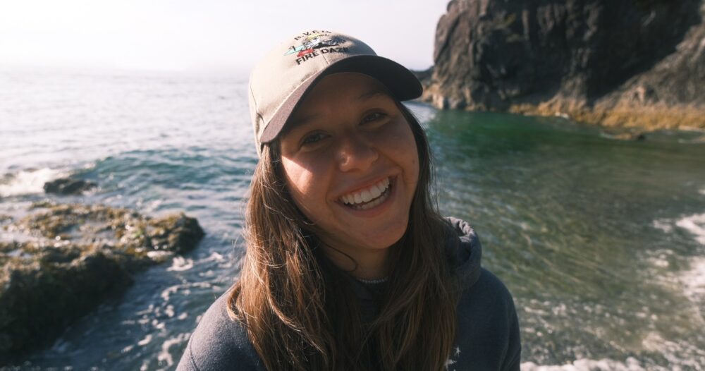 Headshot of Kiara Kattler in front of the ocean.