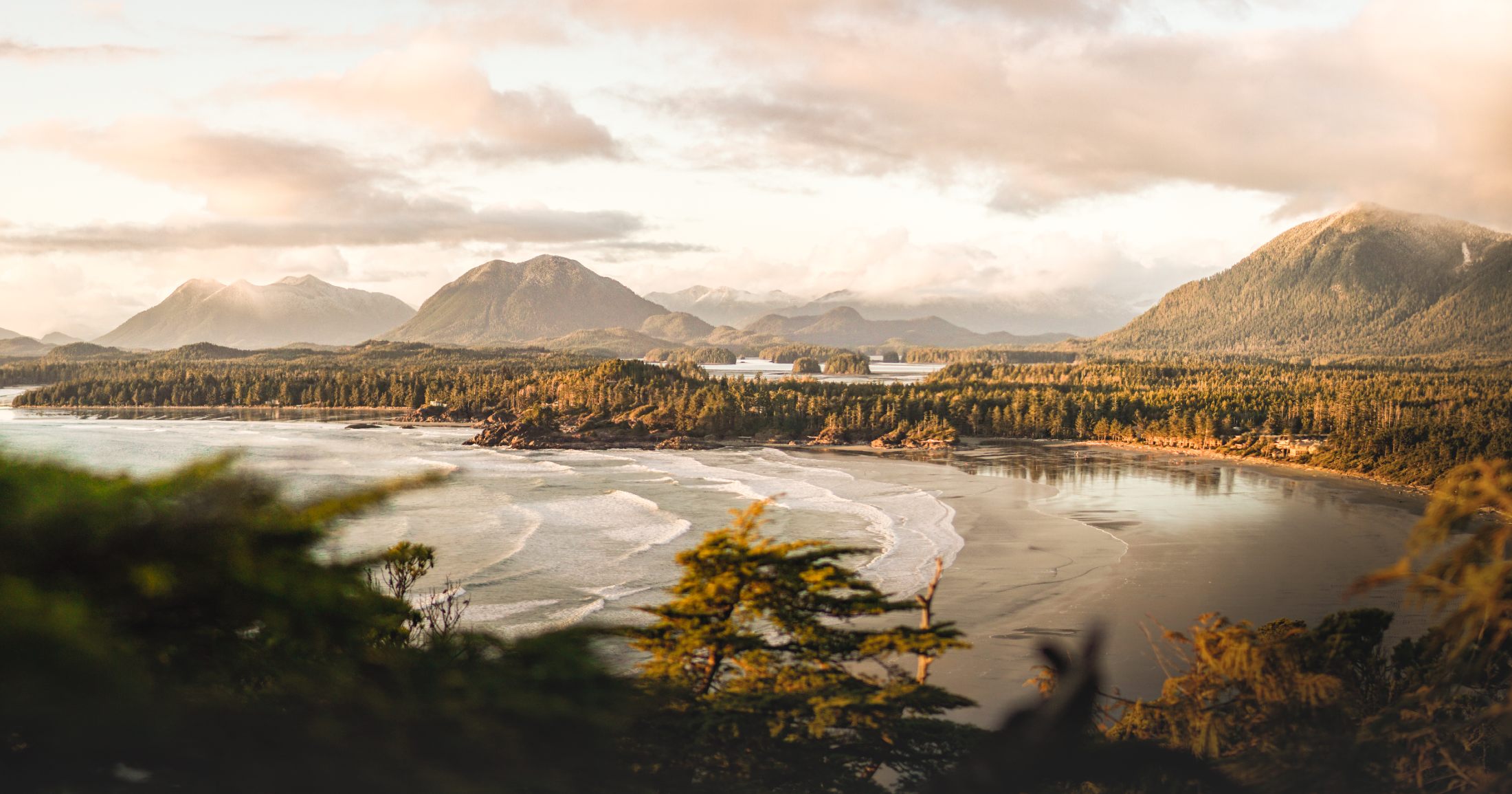 A view of a bay with mountains in the background.